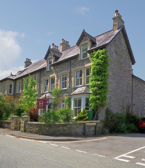 A stone building with multiple windows and a sign indicating it is a B&B. - Brookdale B&B (Wadebridge)