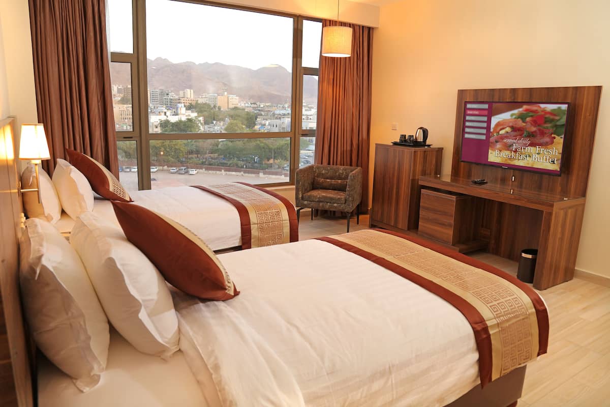 superior room, 1 bedroom, city view, courtyard area | in-room safe, desk, soundproofing, iron/ironing board