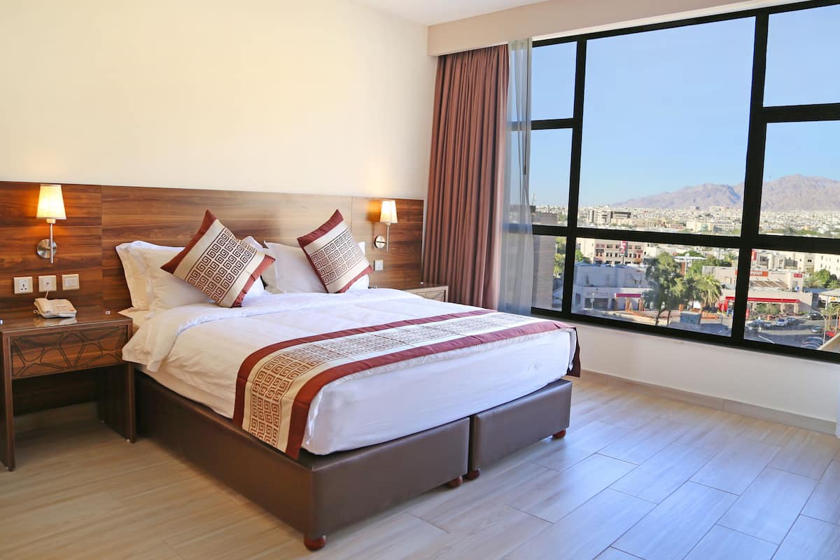 superior room, 1 bedroom, city view, courtyard area | in-room safe, desk, soundproofing, iron/ironing board