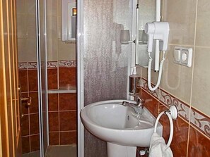 Shower, free toiletries, hair dryer, slippers