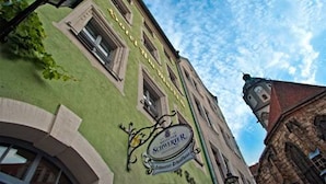 A building with a sign that reads "SCHIBERER" and "Hotel Restaurant."