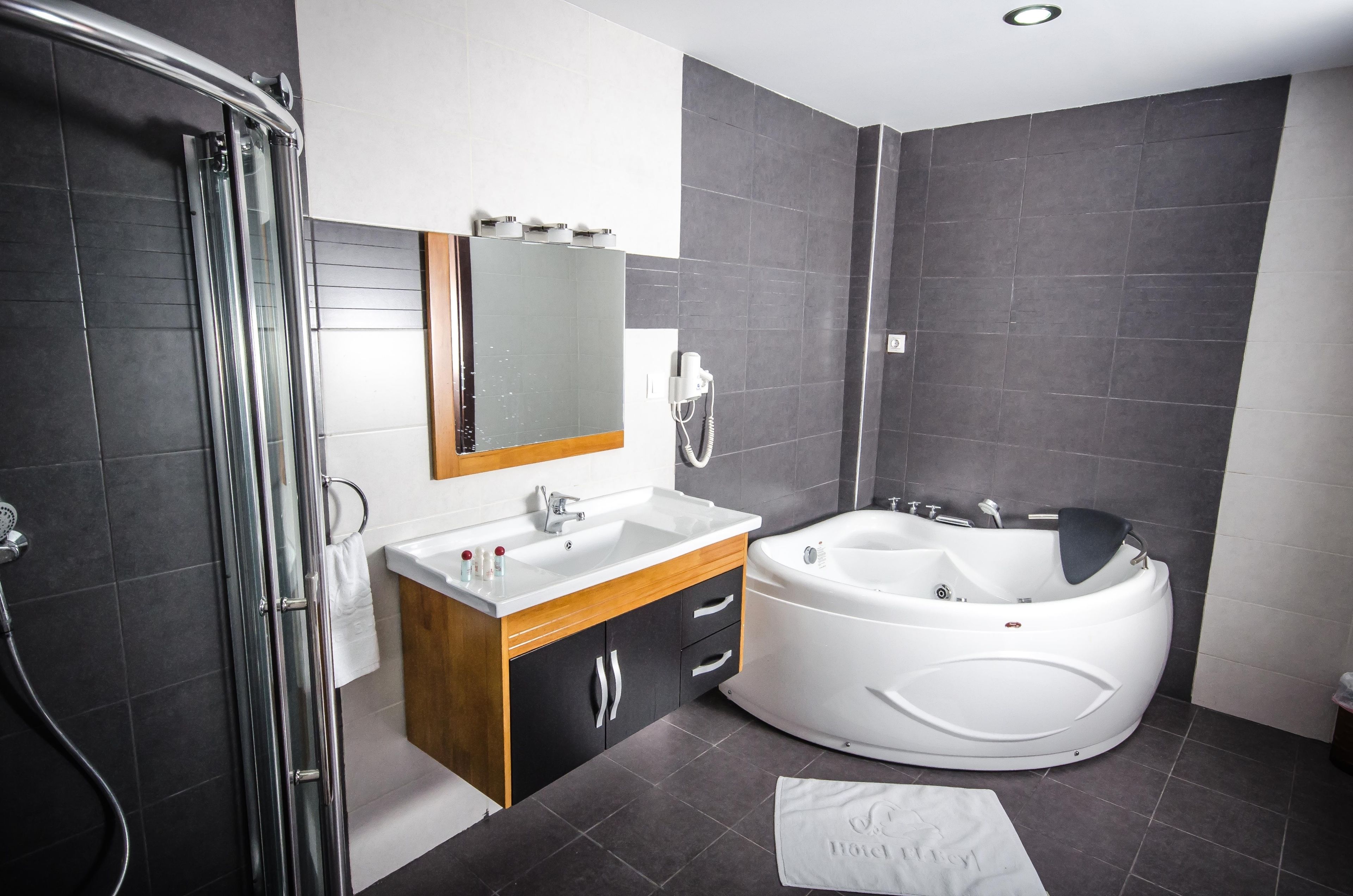suite | bathroom | deep-soaking bathtub, free toiletries, hair dryer, dressing gowns