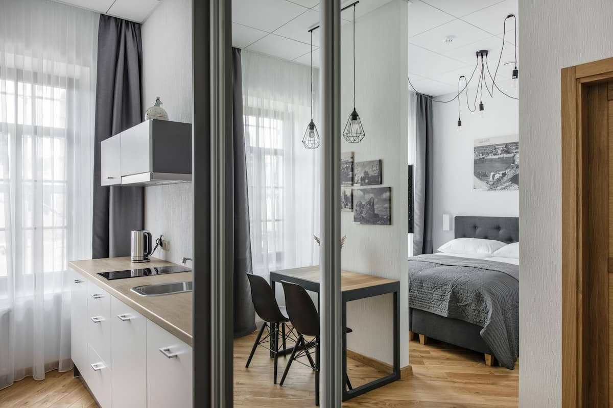 Deluxe Double Room, 1 Queen Bed, Courtyard View | Desk, laptop workspace, soundproofing, iron/ironing board