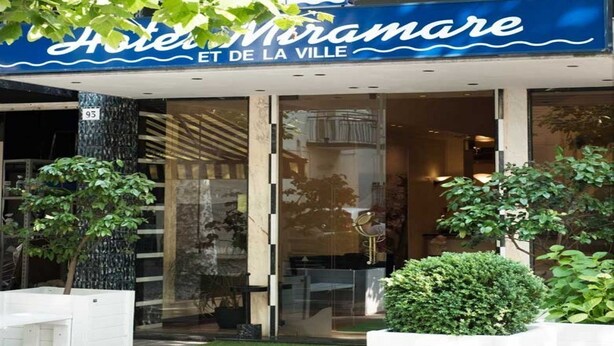 The exterior of Hotel Miramare with a modern facade, large glass windows, and a sign indicating it is located at 93. - Hotel Miramare et de la Ville (Miramare di Rimini)