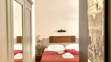 Habitación triple | Ropa de cama de alta calidad y minibar