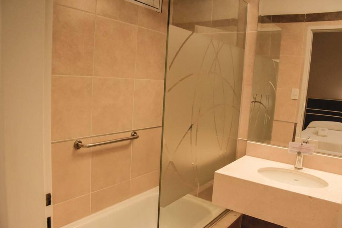 deep-soaking bathtub, rainfall showerhead, free toiletries, hair dryer