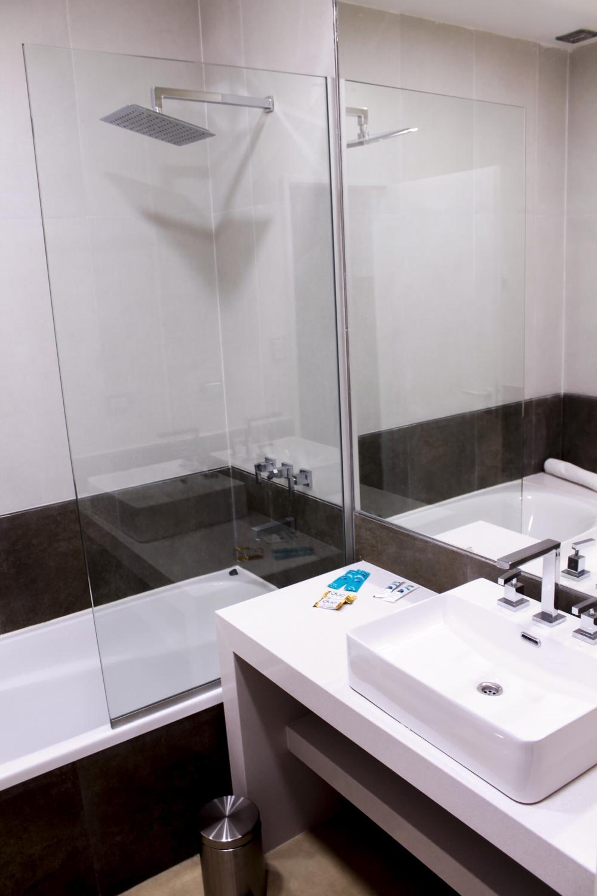 deep-soaking bathtub, rainfall showerhead, free toiletries, hair dryer