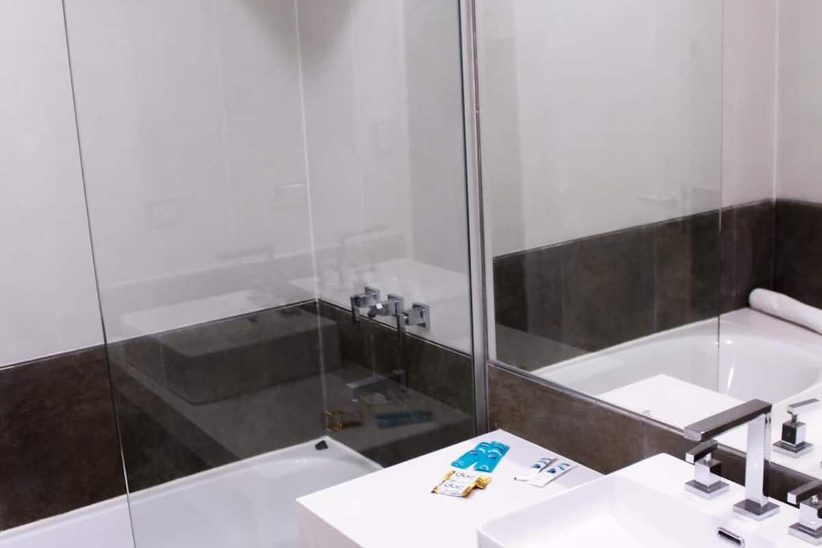 deep-soaking bathtub, rainfall showerhead, free toiletries, hair dryer