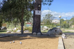 Relax in a serene outdoor setting, where you can play a game of boules or pétanque on the well-maintained lawn.