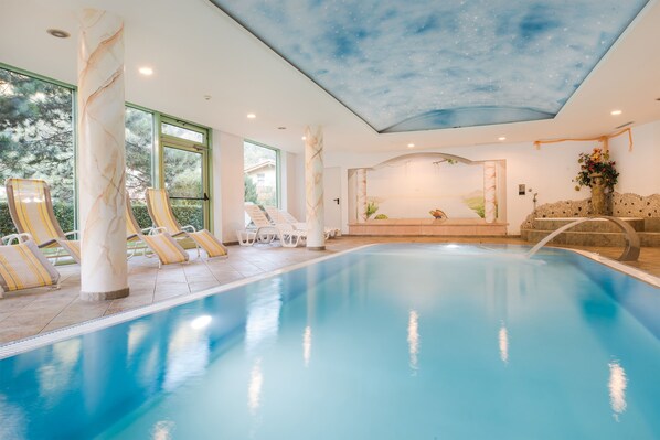 Indoor pool, open 7 AM to 7:30 PM, pool umbrellas, pool loungers