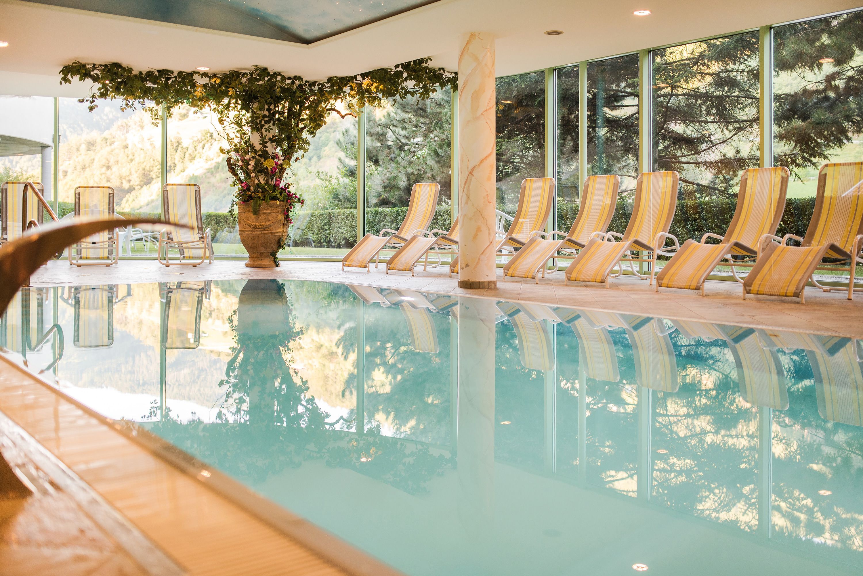 indoor pool, open 7 am to 7:30 pm, pool umbrellas, pool loungers