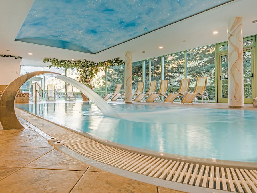 Indoor pool, open 7 AM to 7:30 PM, pool umbrellas, pool loungers