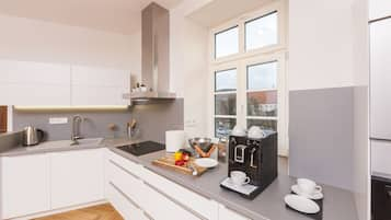 Deluxe Apartment, 1 Queen Bed (Dlx 1) | Private kitchen | Fridge, stovetop, coffee/tea maker, electric kettle