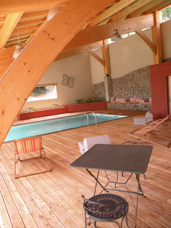 Indoor pool, seasonal outdoor pool, pool umbrellas, pool loungers