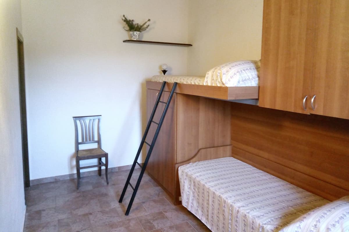 Individually decorated, individually furnished, desk, rollaway beds
