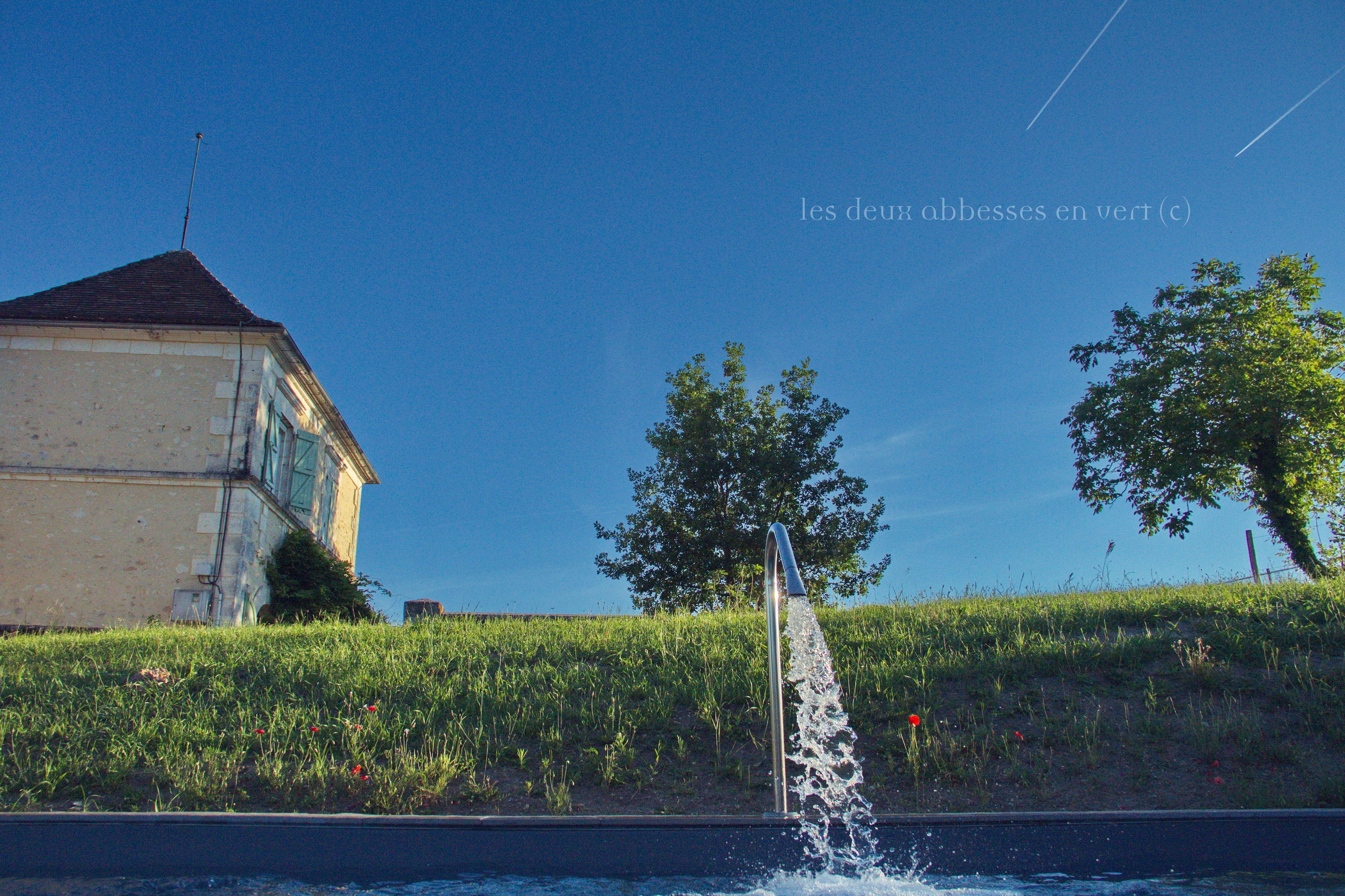 Outdoor pool, a waterfall pool, pool loungers