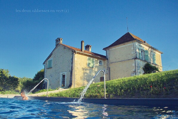 Outdoor pool, a waterfall pool, pool loungers