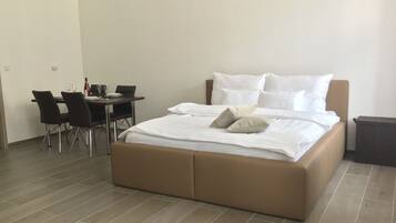 Comfort Apartment, City View | 1 bedroom, desk, blackout drapes, iron/ironing board