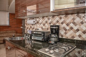 Apartment, 2 Bedrooms (402) | Private kitchen | Full-sized fridge, microwave, oven, stovetop - The 9's Aparta Hotel (Medellín)