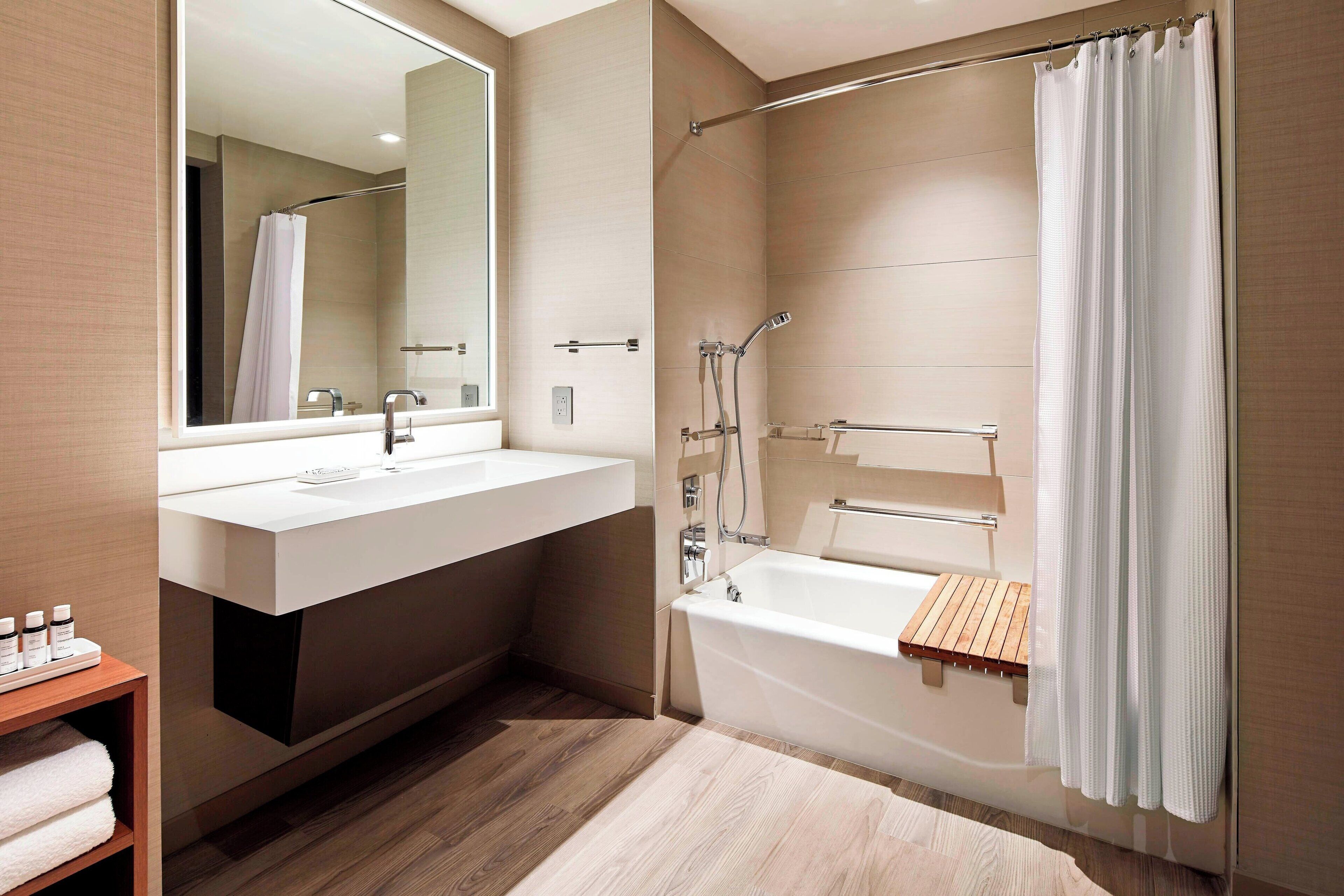 combined shower/bathtub, designer toiletries, hair dryer, bathrobes