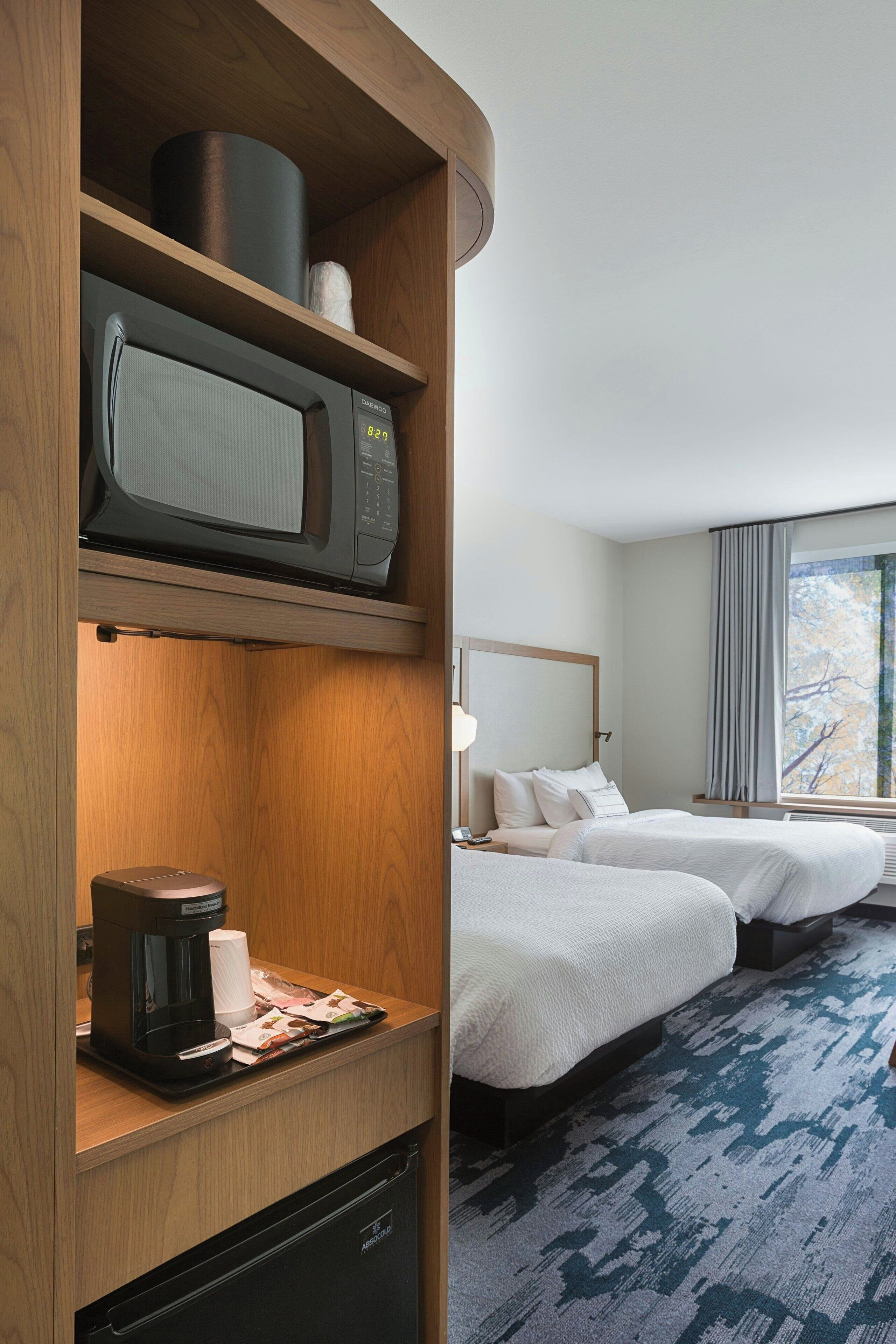 room, 2 queen beds | desk, iron/ironing board, free cots/infant beds, free rollaway beds