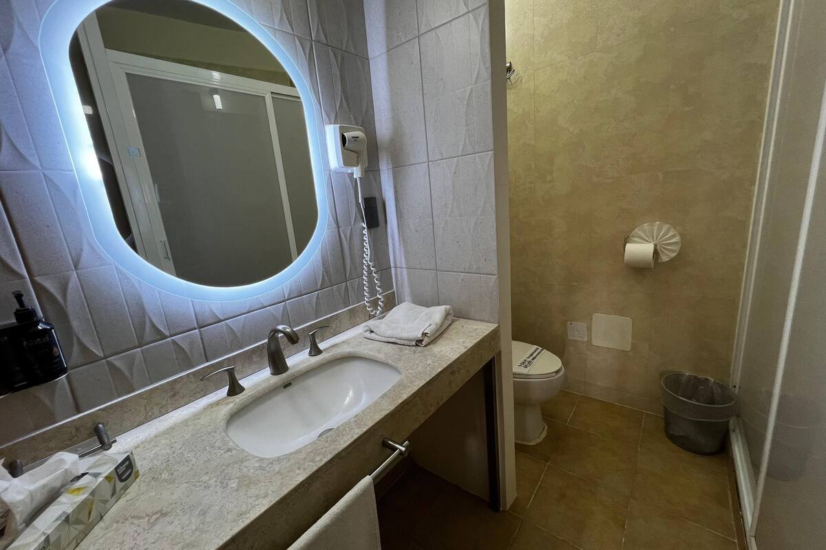 superior studio suite, 2 queen beds, balcony | bathroom | rainfall showerhead, free toiletries, hair dryer, towels