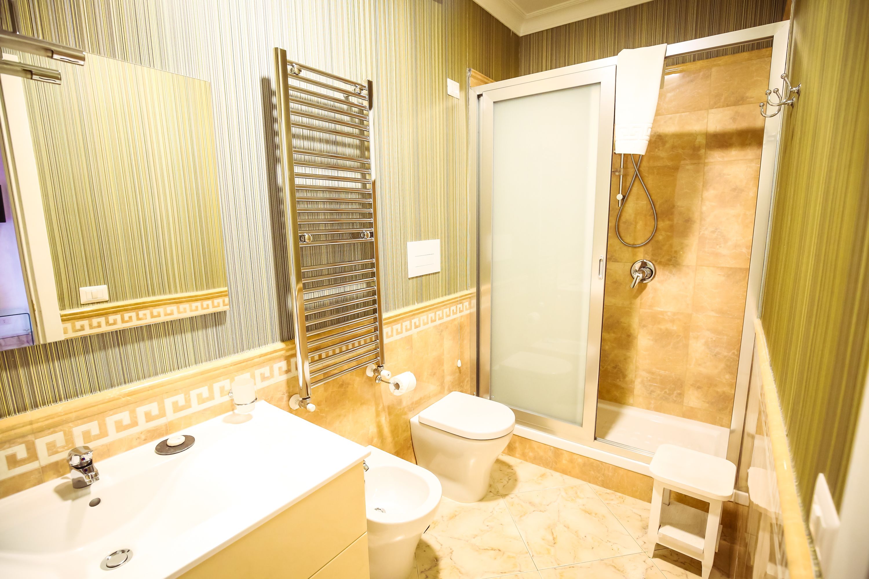 deluxe quadruple room | bathroom | free toiletries, slippers, bidet, towels