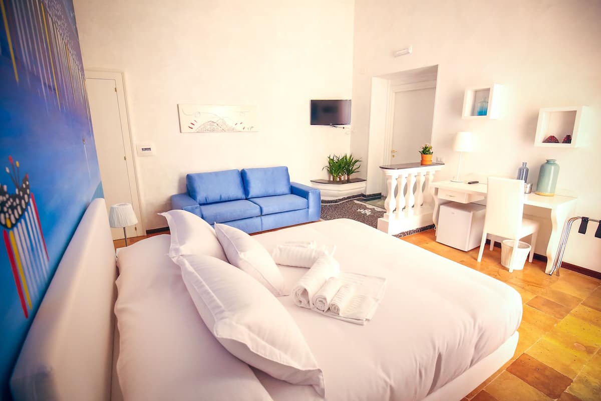 Comfort vierpersoonskamer | 1 slaapkamer, luxe beddengoed, een minibar, een kluis op de kamer