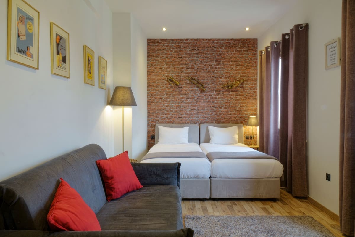 Suite superior, vista a la ciudad | 1 habitación, sábanas de algodón egipcio y ropa de cama de alta calidad