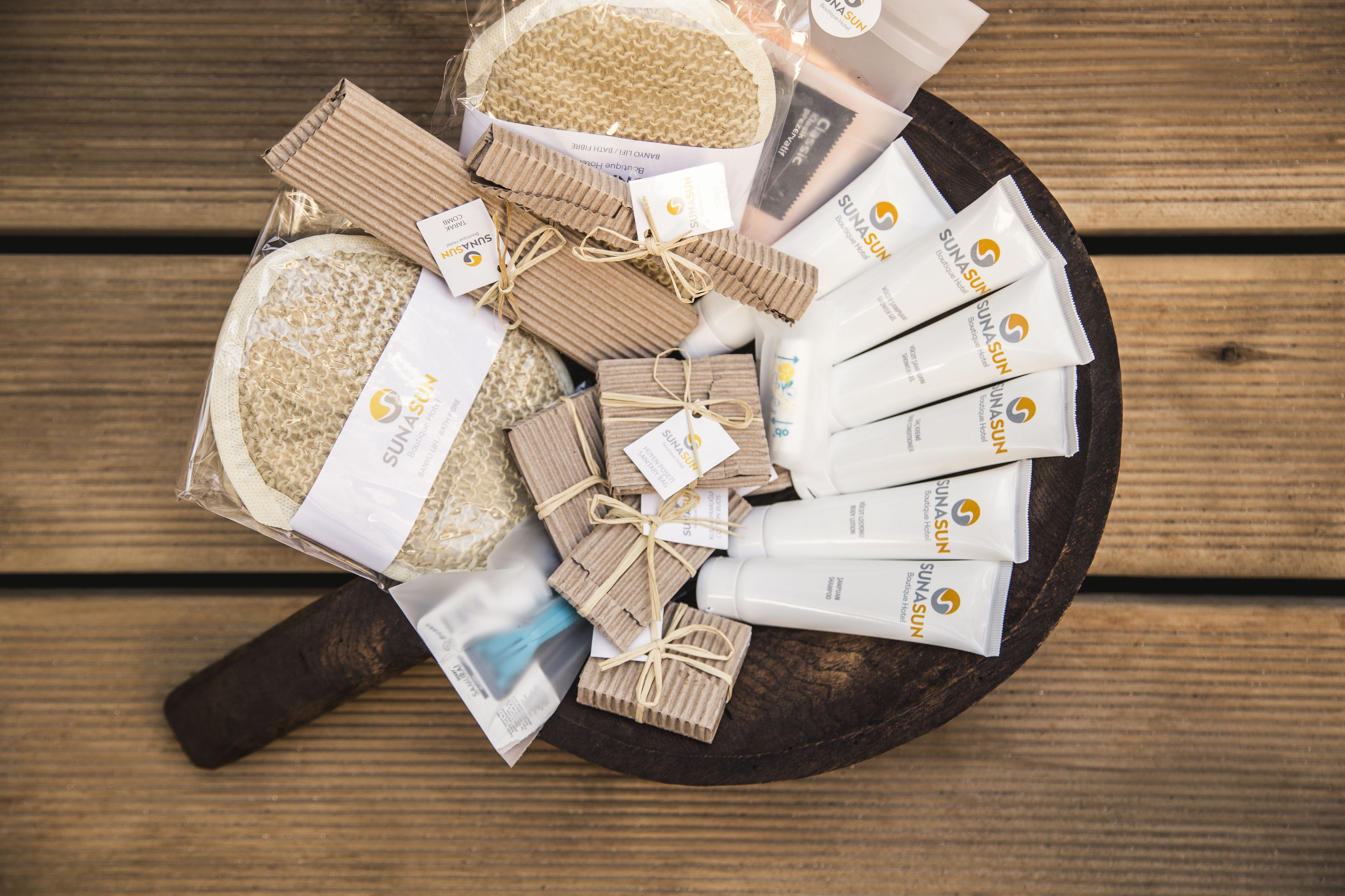 designer toiletries, hair dryer, slippers, towels