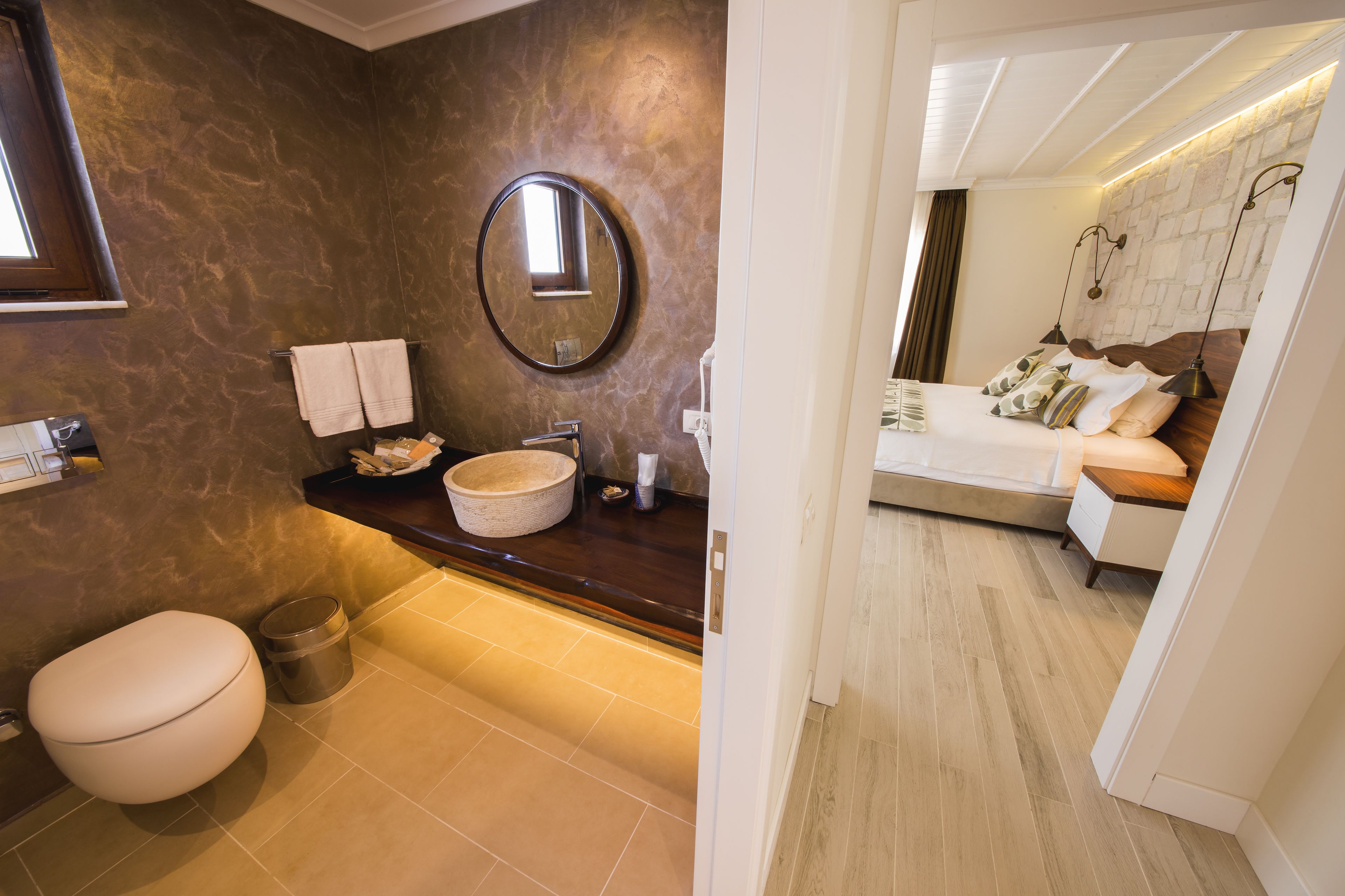 deluxe room, partial sea view | bathroom | designer toiletries, hair dryer, slippers, towels