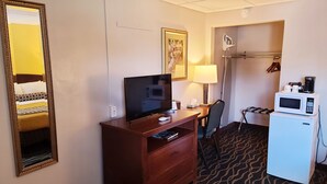 A hotel room with a bed, a TV, a desk with a lamp, a microwave, and a refrigerator. - Hampton Inn (not a Hilton Affiliate) Camp Hill - Harrisburg SW (Camp Hill)