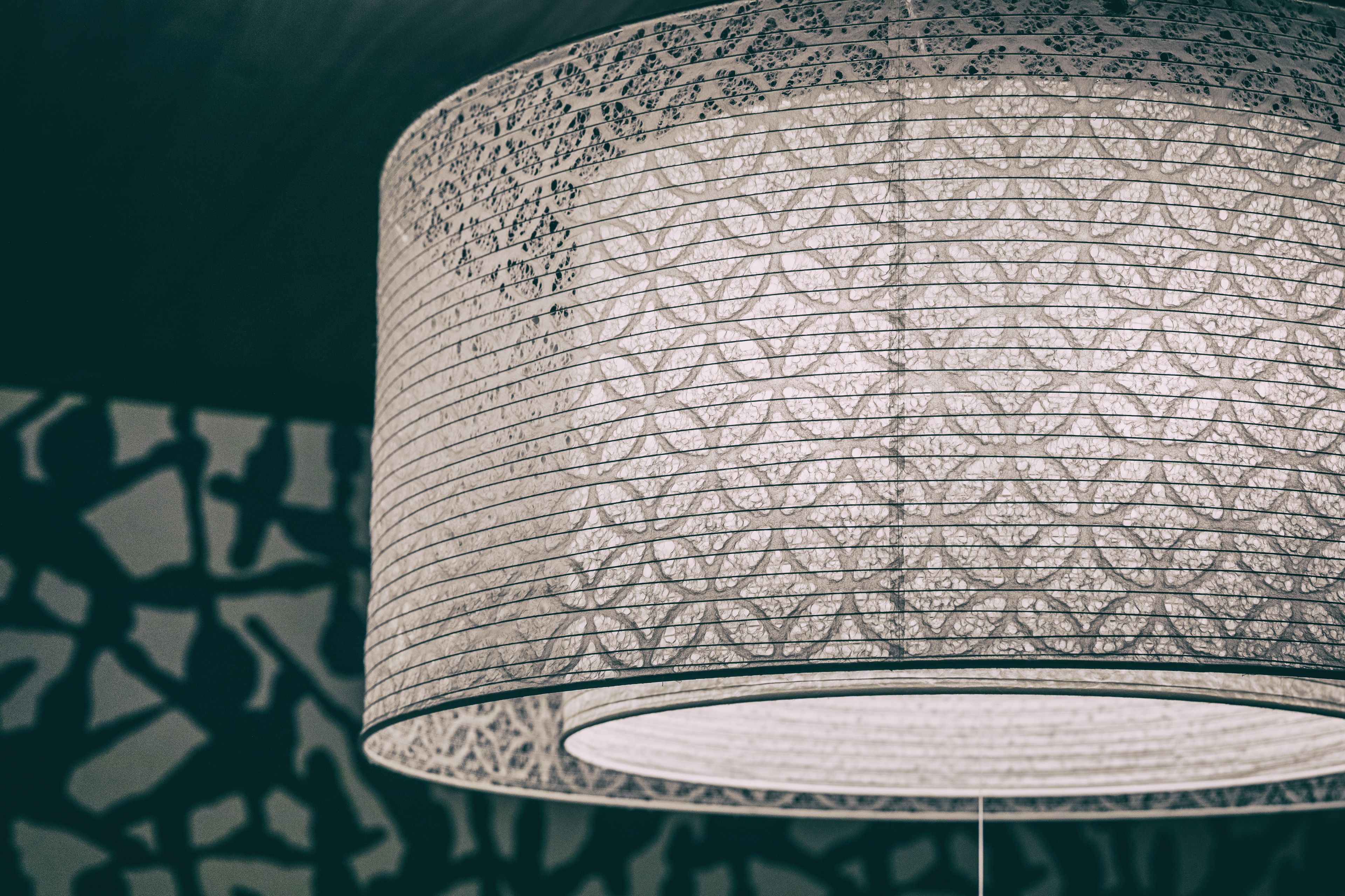 A cylindrical, intricately patterned light fixture.