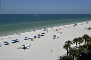 On the beach, sun-loungers, beach umbrellas, beach towels