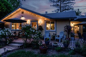 A cozy house with a deck, outdoor seating, and string lights. - Charming Country Home Nestled In Kenwood Village the heart of the wine country.  (Kenwood)