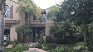 A residential house with a well-maintained garden, a driveway, and a garage. - Legoland Beach 1.5mi canyon golf  Four Seasons Aviara Carlsbad-1/2 acre- (Carlsbad)