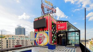 A building with a large sign reading 'ME STY GARAGE' and 'ME MYSELF' on the side. - MeStyle Garage Hotel (Bangkok)