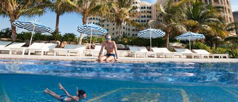 2 outdoor pools, pool umbrellas, pool loungers
