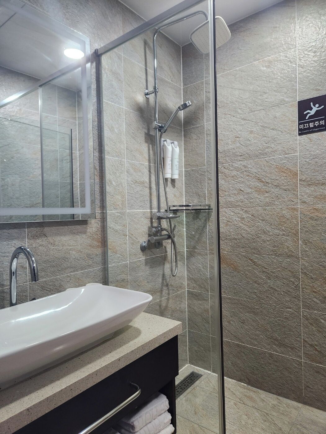 family suite (lake city view) | bathroom | hair dryer, slippers, bidet, towels