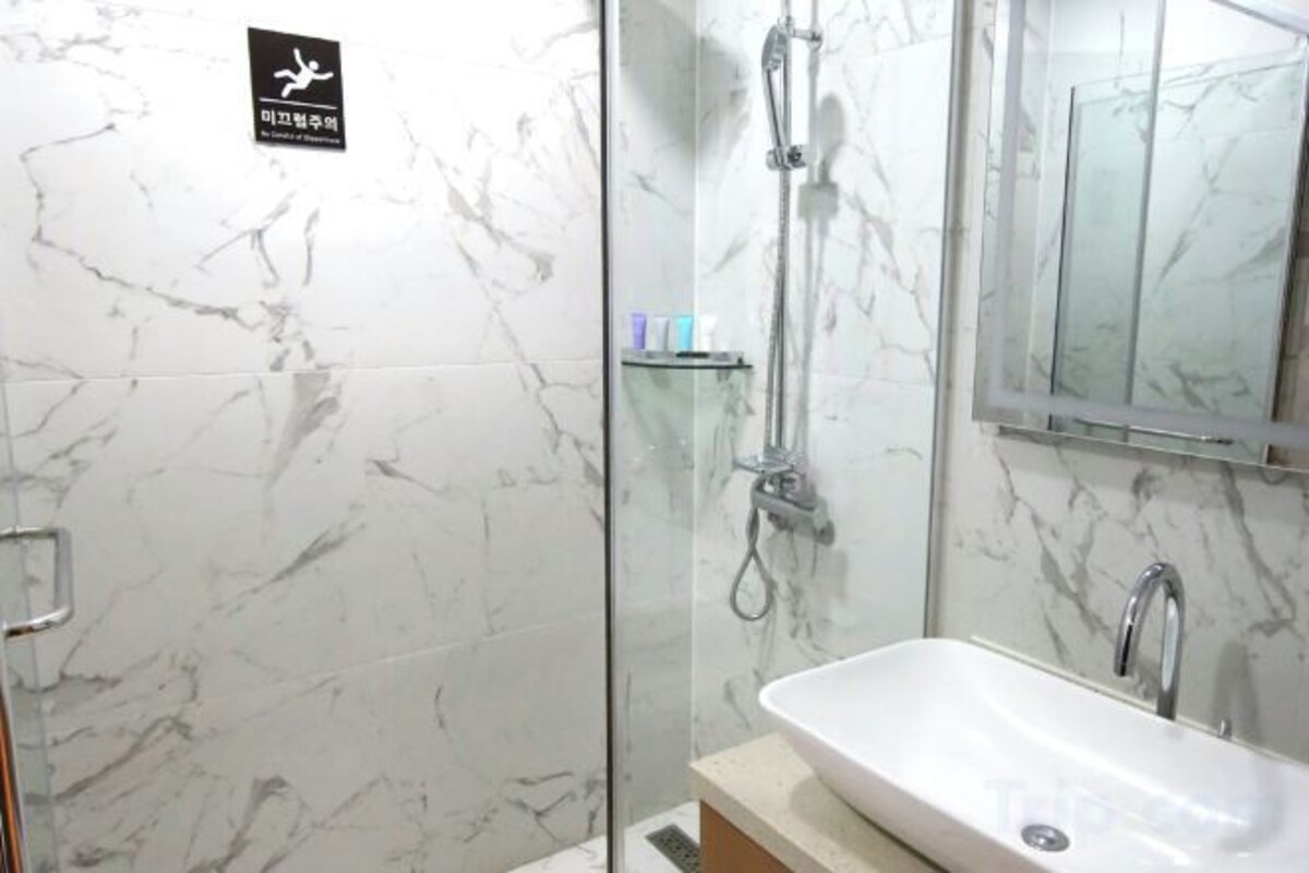 Bathroom | Hair dryer, slippers, bidet, towels