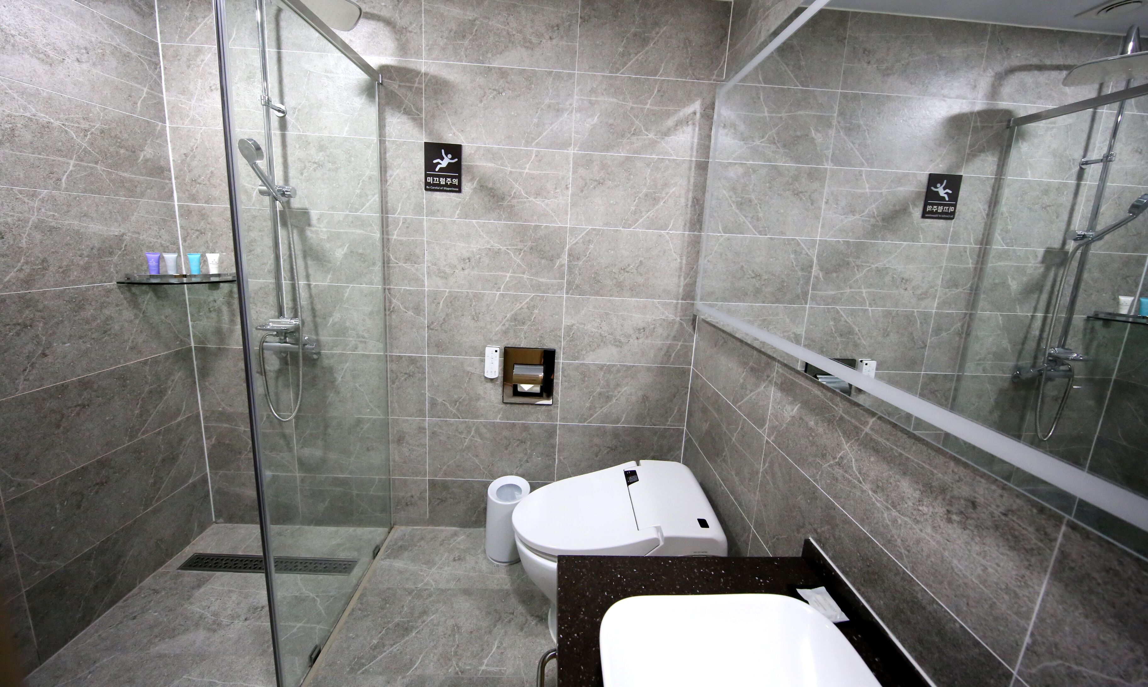 hair dryer, slippers, bidet, towels