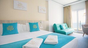 Suite, Sea View | Minibar, in-room safe, desk, laptop workspace