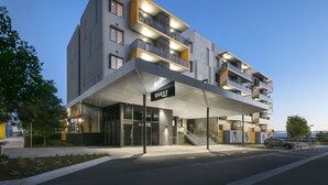 A modern hotel with a covered entrance, multiple balconies, and a sign reading "QUEST". - Quest Notting Hill (Notting Hill)
