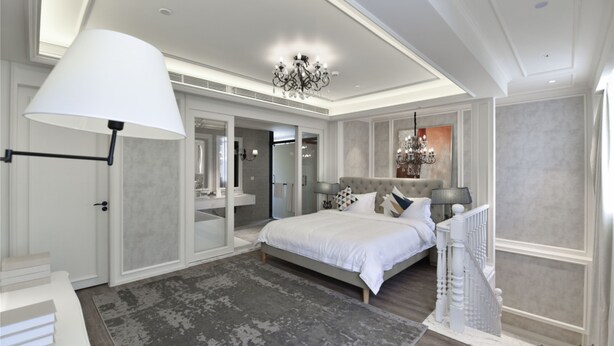 A modern bedroom with a large bed, a chandelier, and a view of the bathroom. - City Inn OCT Loft Branch (Shenzhen)