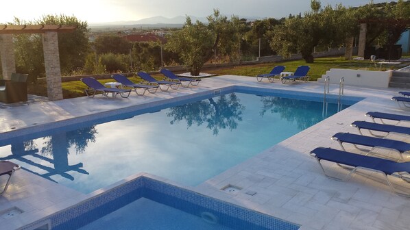 2 outdoor pools, pool umbrellas, pool loungers