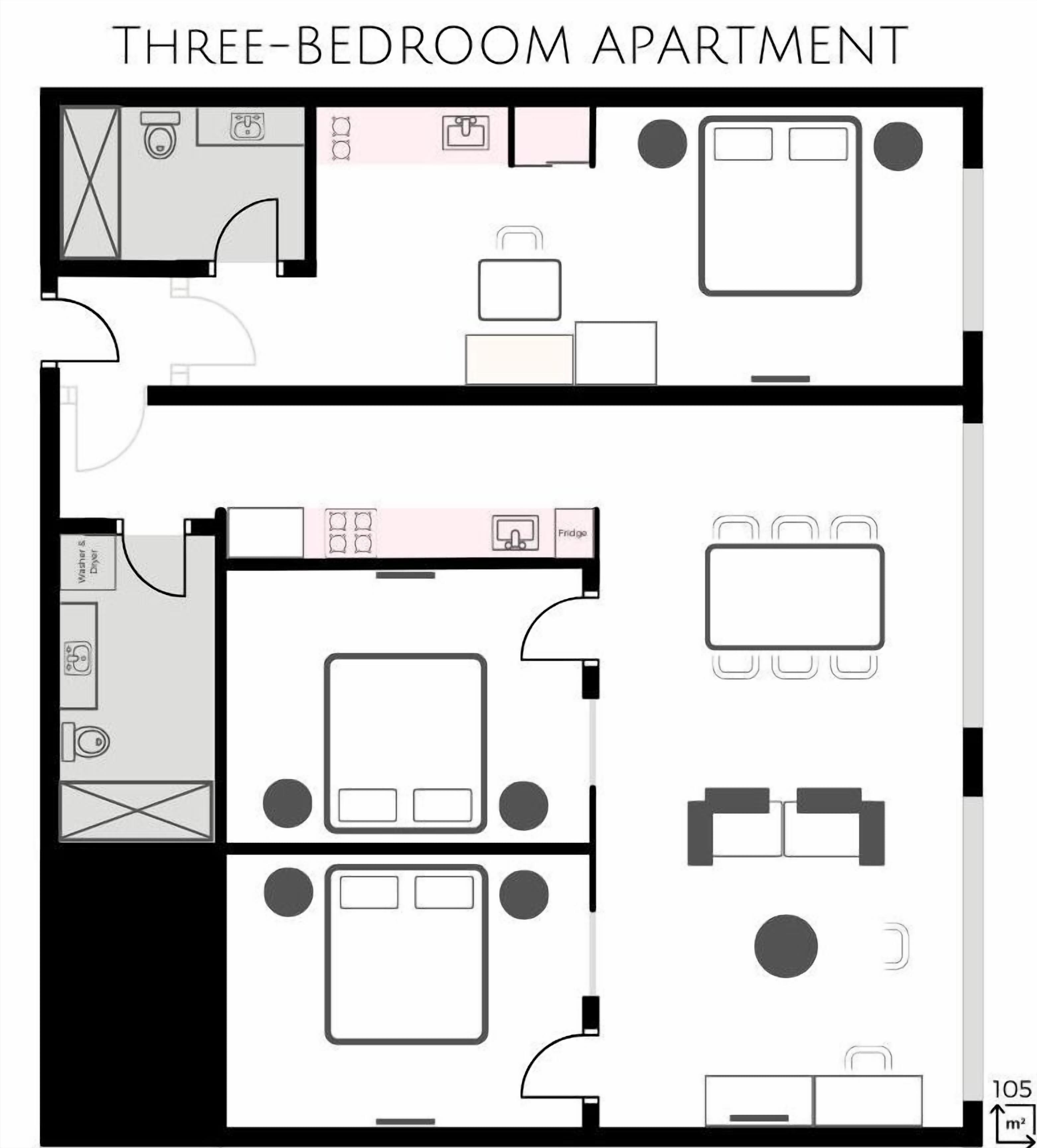Grundriss einer Dreizimmerwohnung mit Küche, Essbereich und zwei Bädern.