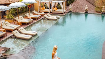 Outdoor pool, open 7:30 AM to 8:00 PM, free cabanas, pool umbrellas