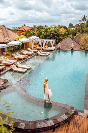 Outdoor pool, open 7:30 AM to 8:00 PM, free cabanas, pool umbrellas