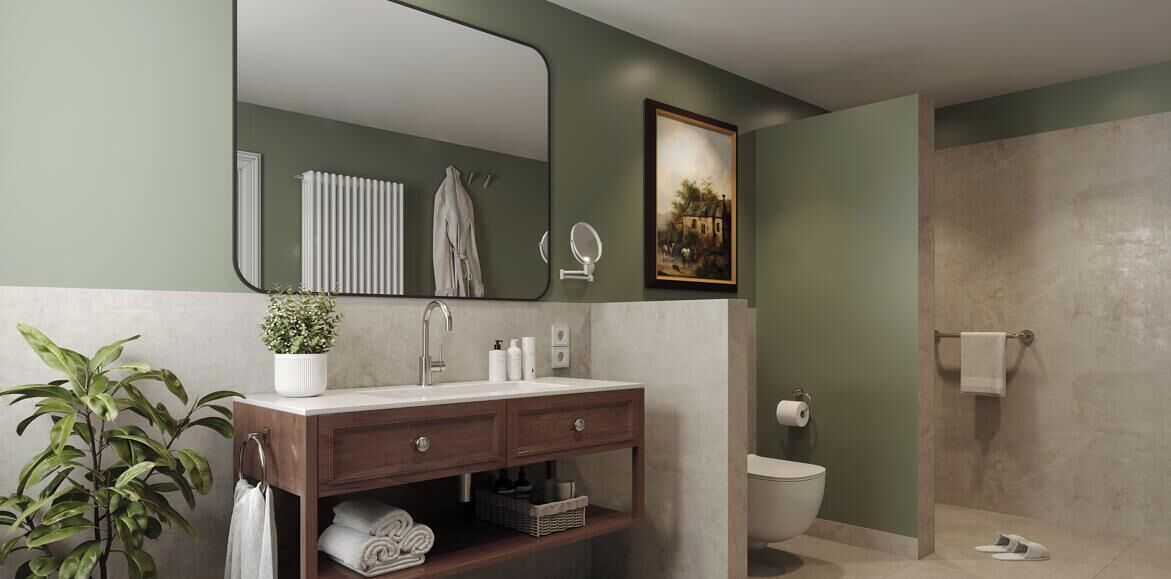 A bathroom with a vanity, a mirror, a toilet, and a shower area.