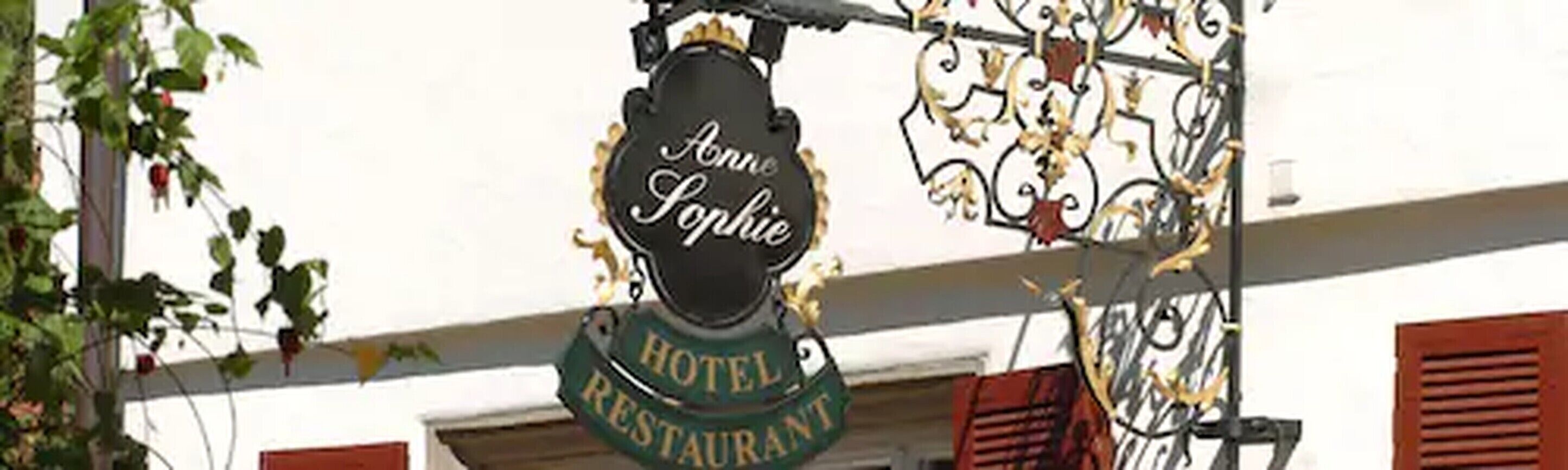 A hotel sign with "Bonne Sophie" and "HOTEL RESTAURANT" indicating a hotel and restaurant establishment.